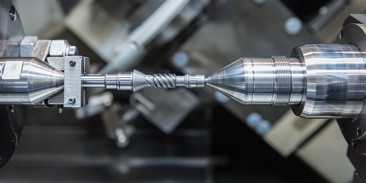 Small steel drive gear in engineering factory close up